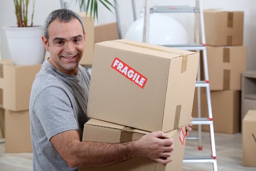 Careful furniture handling during a local house move in Tottenham