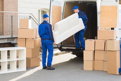 Risk-aware moving team handling furniture in Tottenham