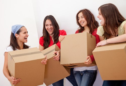 Local removals crew transporting business furniture in Tottenham