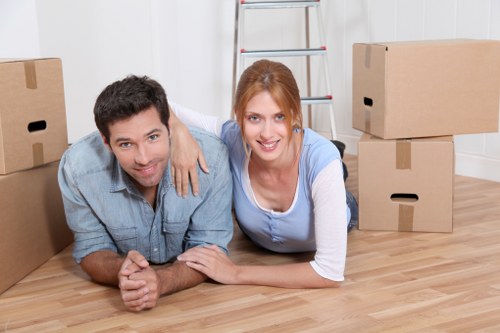 Moving team carrying furniture from a Tottenham property