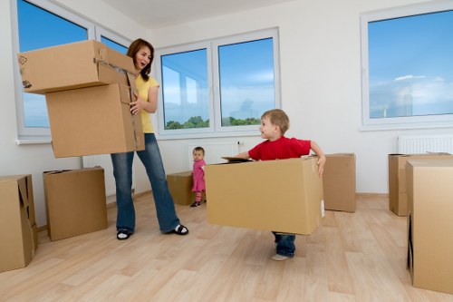 House movers navigating stairs in a Tottenham flat